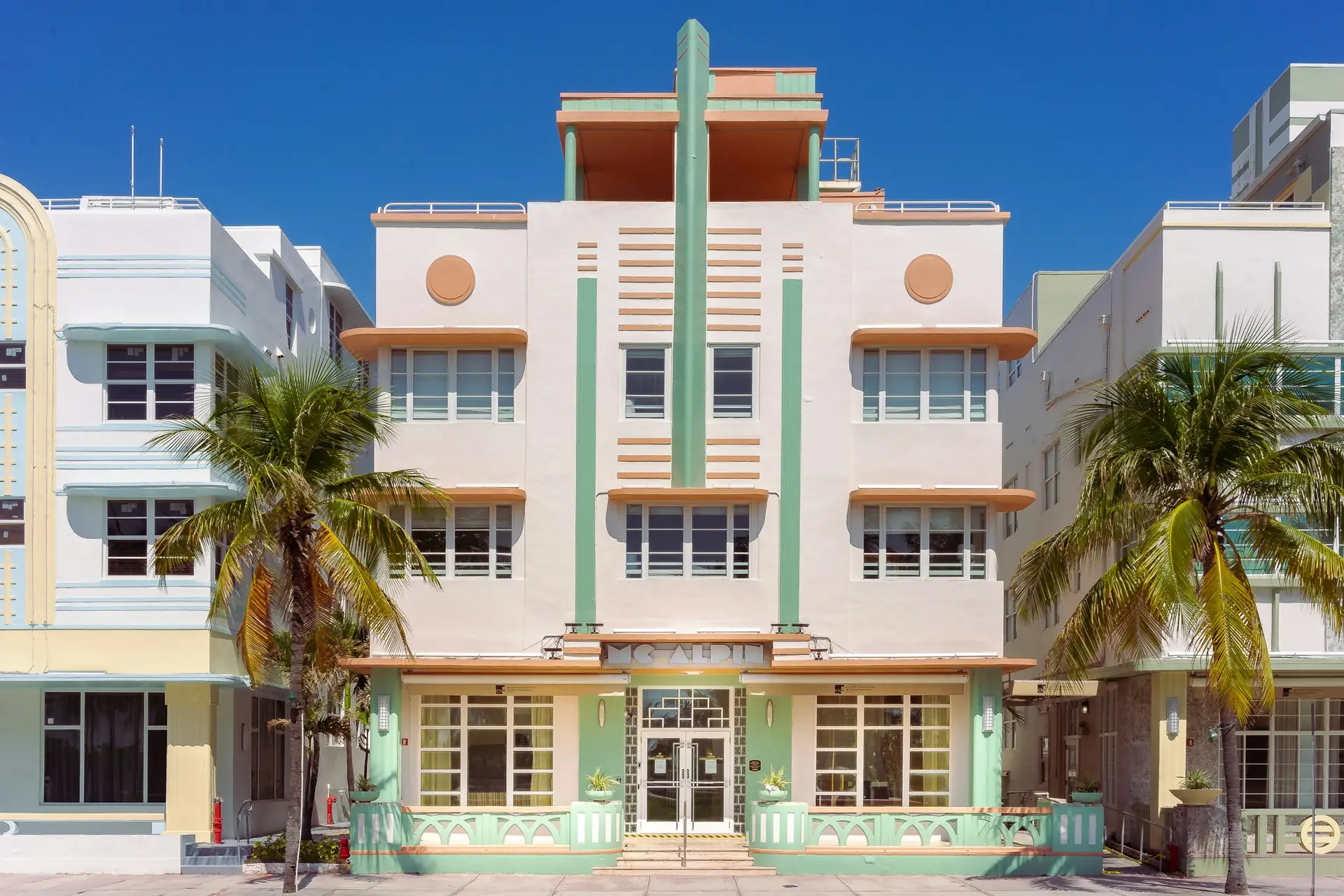 Art Deco hotel with palm trees in Miami Beach