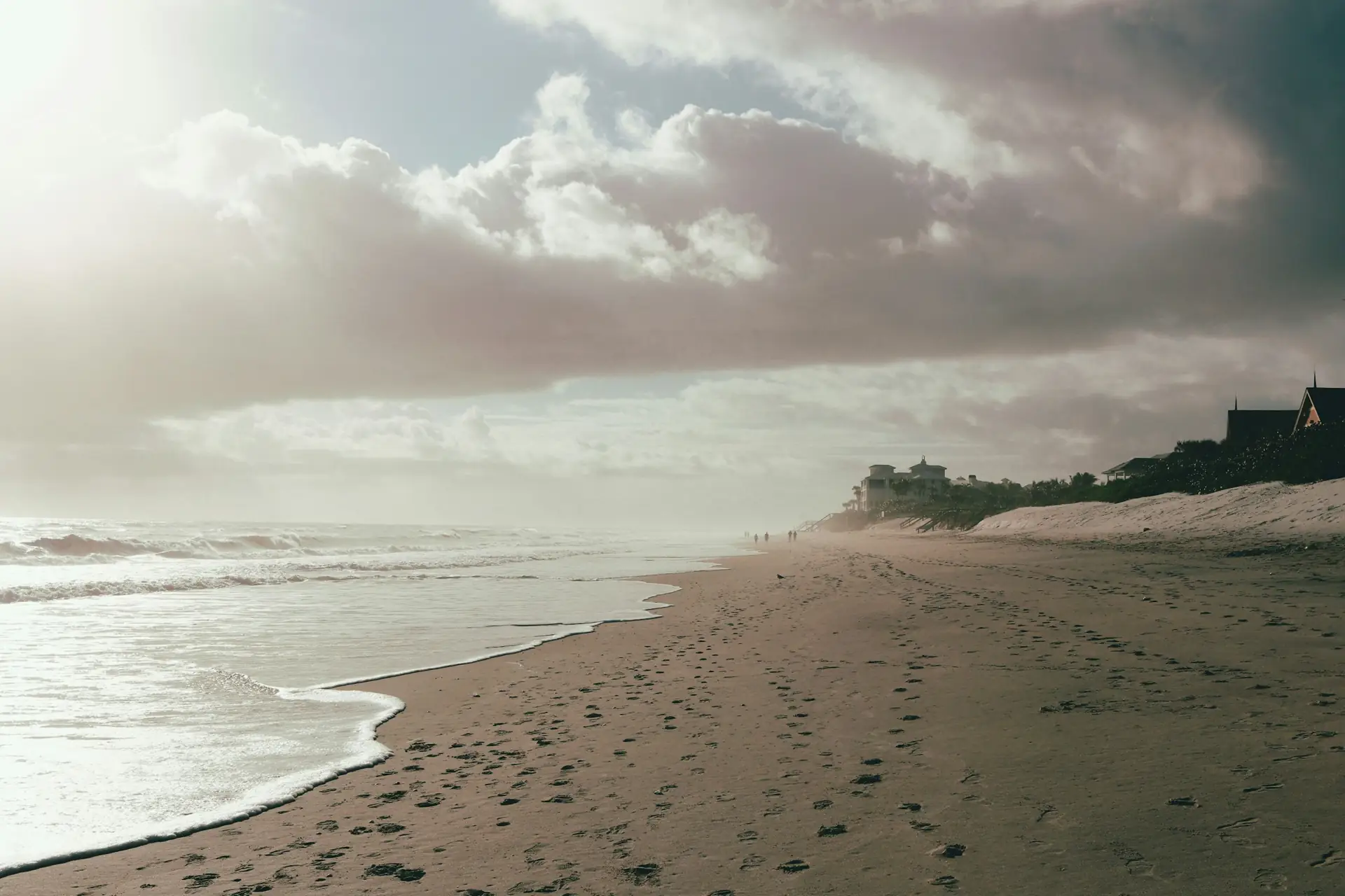 Wide Atlantic beach with footprints in the sand